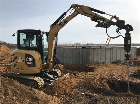 mini excavator helical pier installation|helical pier installation.